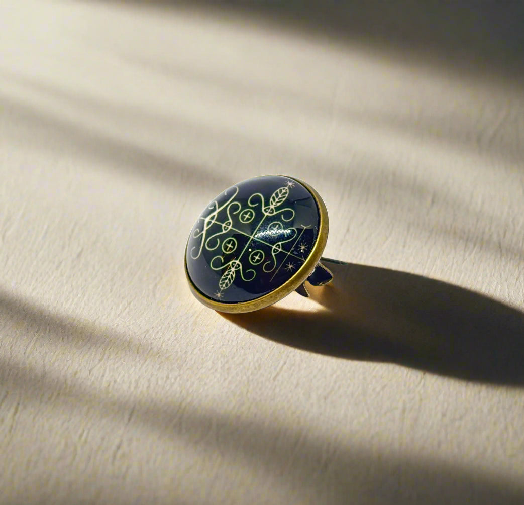 Sheela M Bajaj's Eleguas Amulet Badge