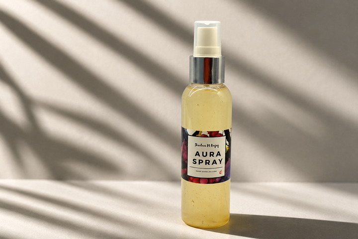 Aura Cleansing Spray by House of Sheelaa in a pale yellow spray bottle, styled in warm sunlight with soft shadows for aura cleansing and energy refreshment.