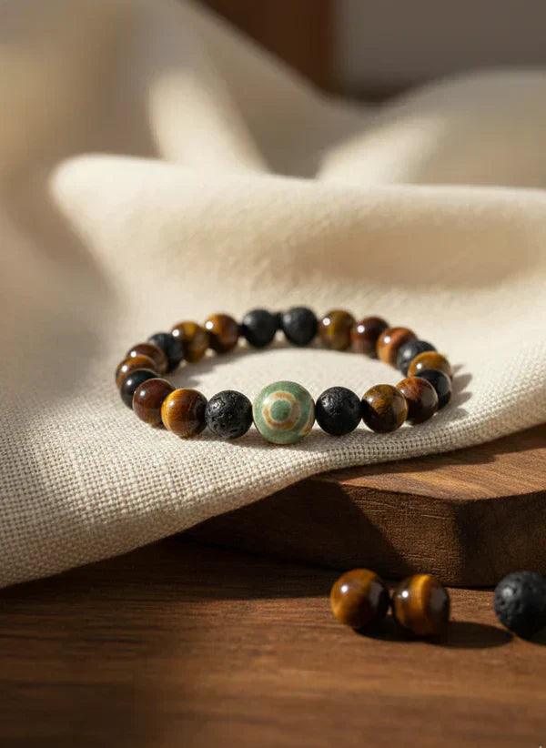 Blockbuster Career & Nazar Bracelet with black and gold beads and evil eye charm on a clean light background.