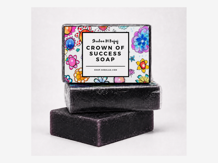 Crown of Success Soap by Sheelaa M Bajaj with dark soap bars, colorful floral label, and clean white product background.