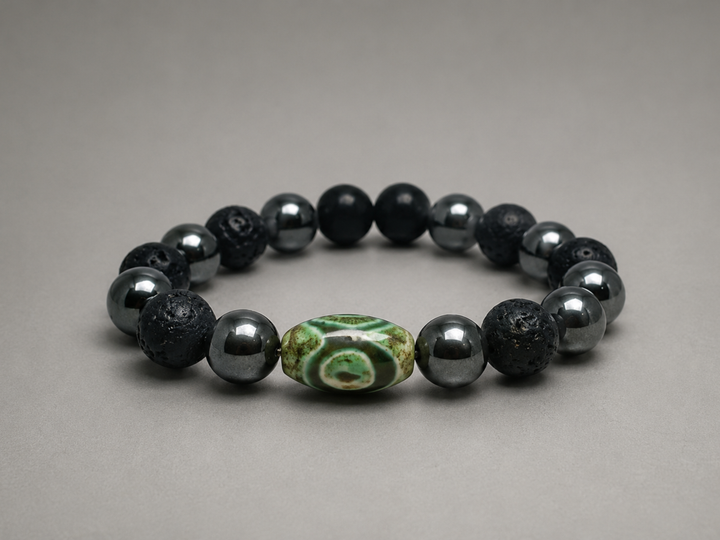 Bhaag Nazar Kids Edition bracelet by House of Sheelaa, featuring black lava beads, shiny hematite-style beads, and a green evil eye bead for nazar protection.